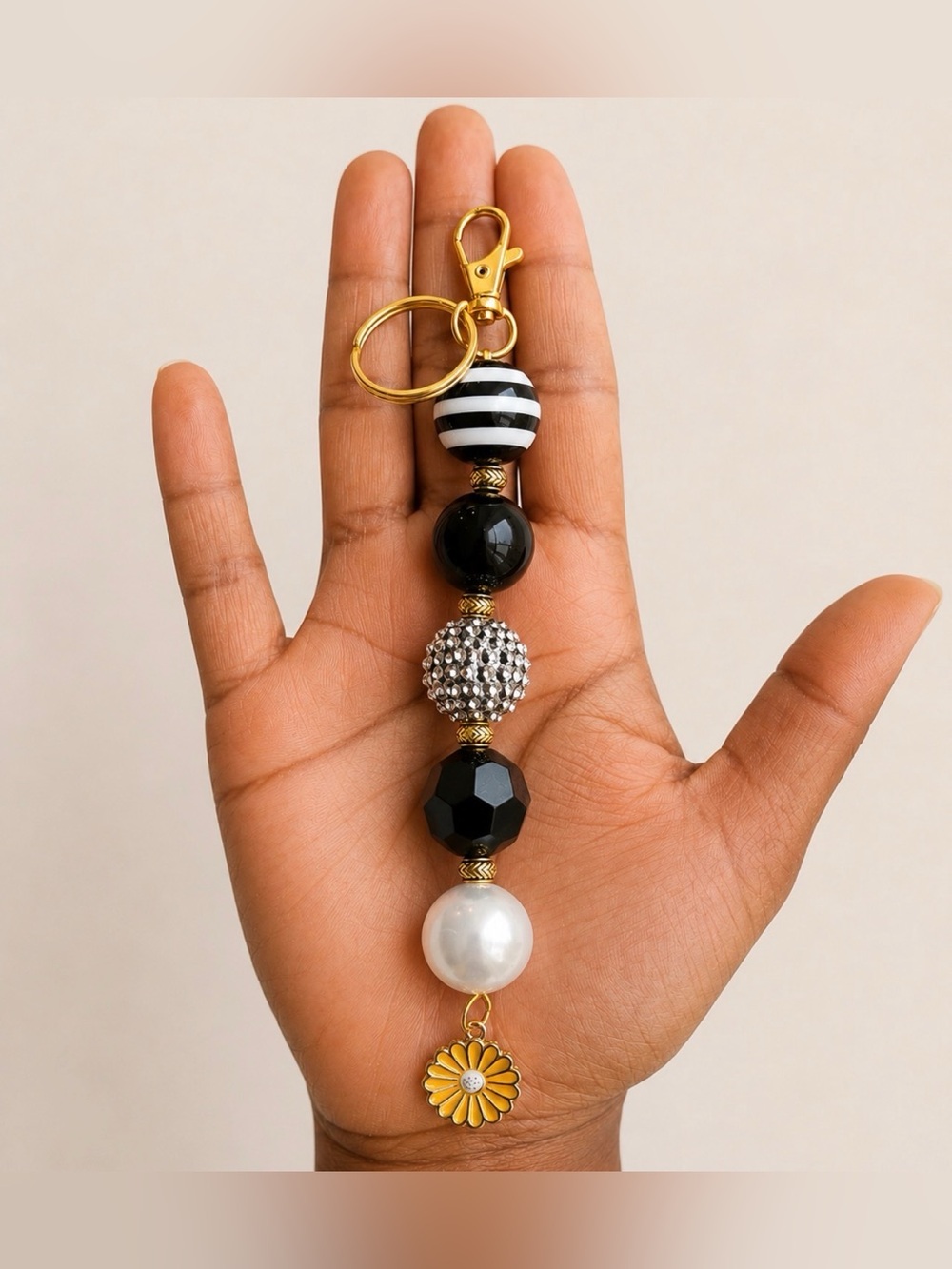 Gold-Tone Black & White Bead Keychain with Daisy Charm